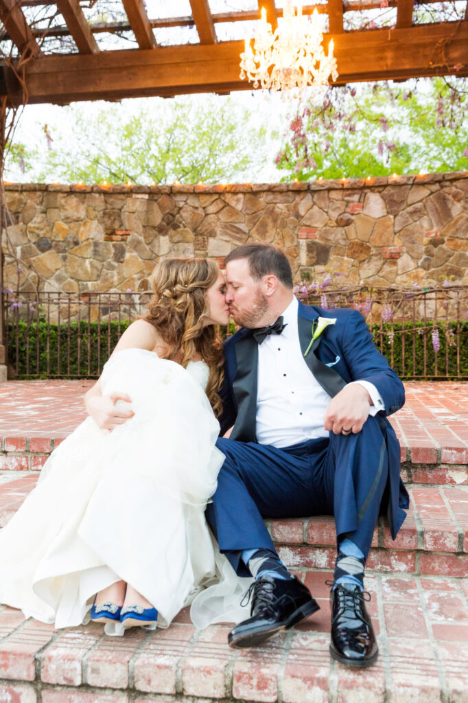 couple kissing under chandelier at estate yountville