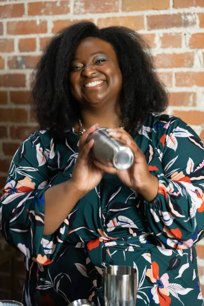 bartender mixing drink smiling