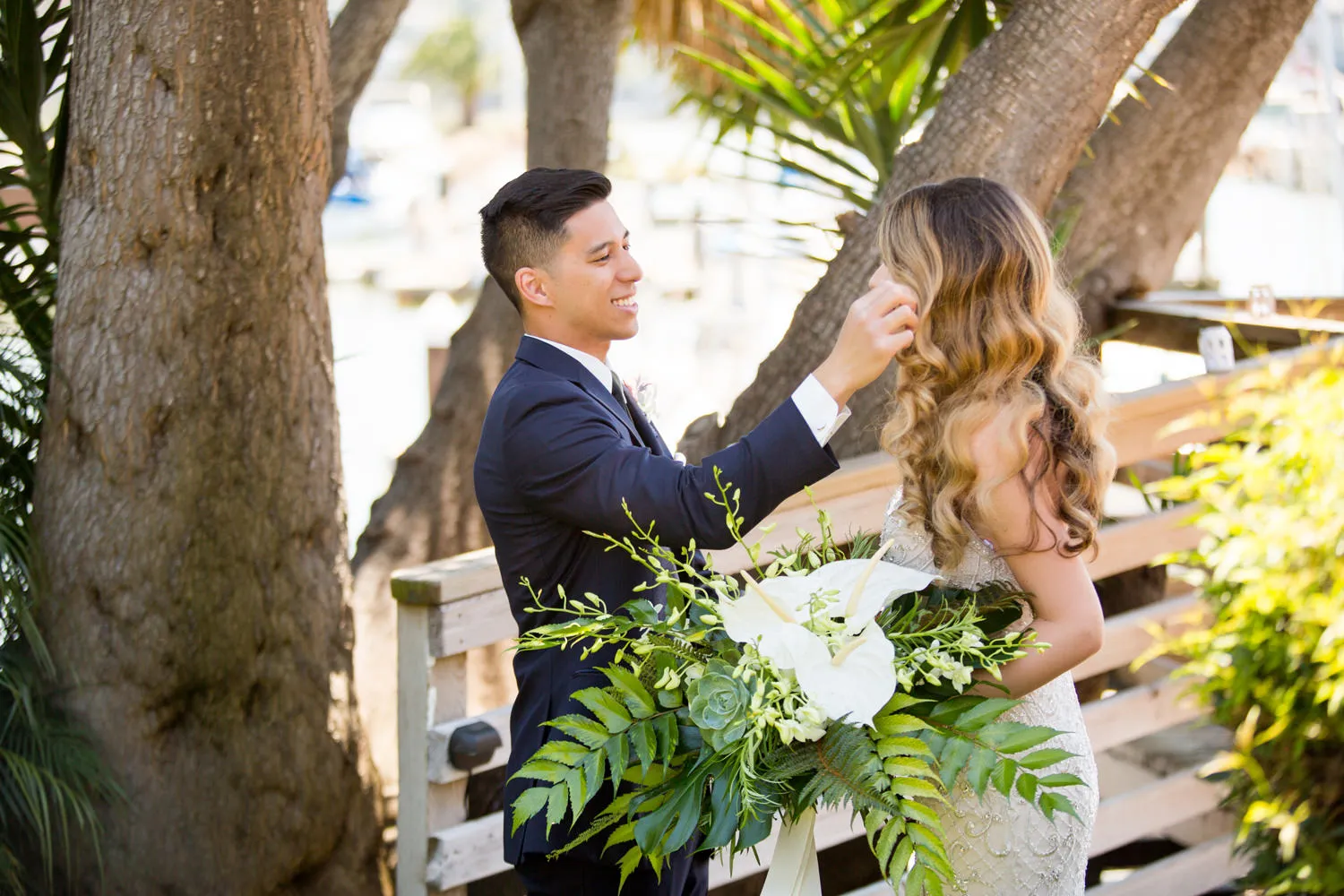 groom wiping tear from bride