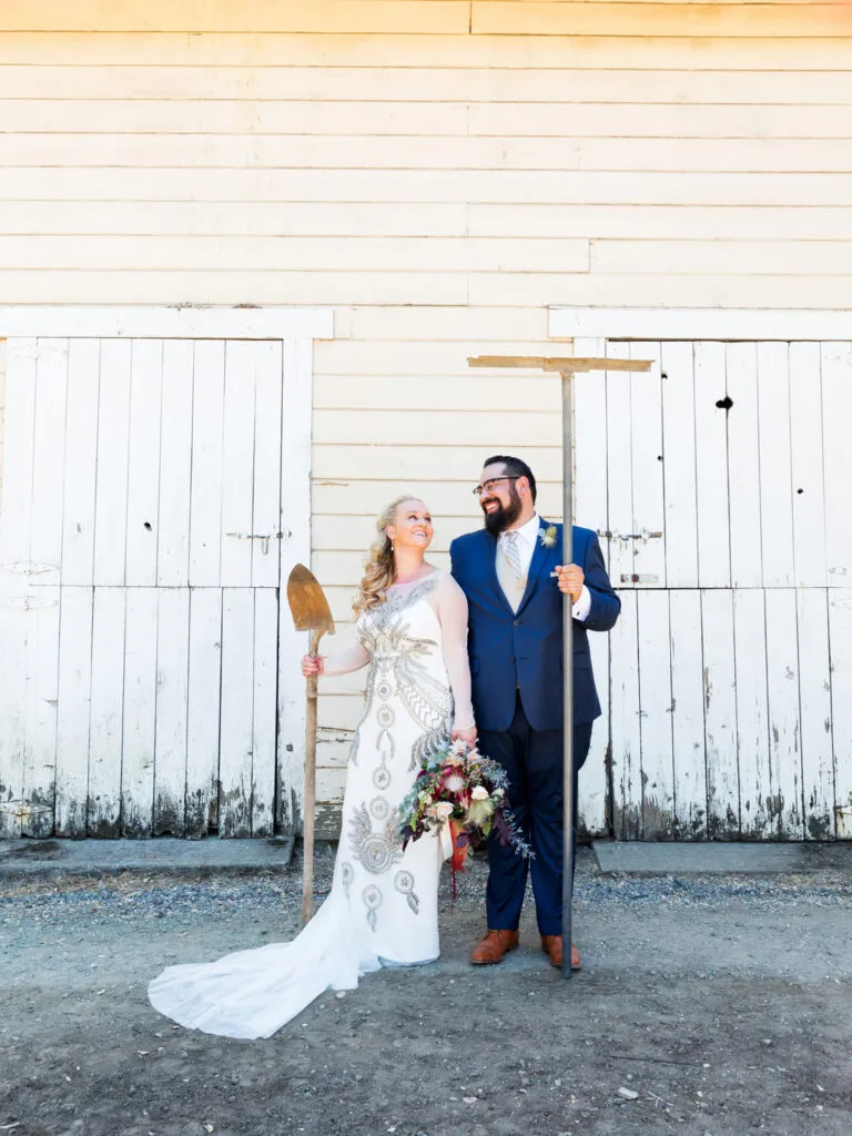 couple in front of barn beltane ranch