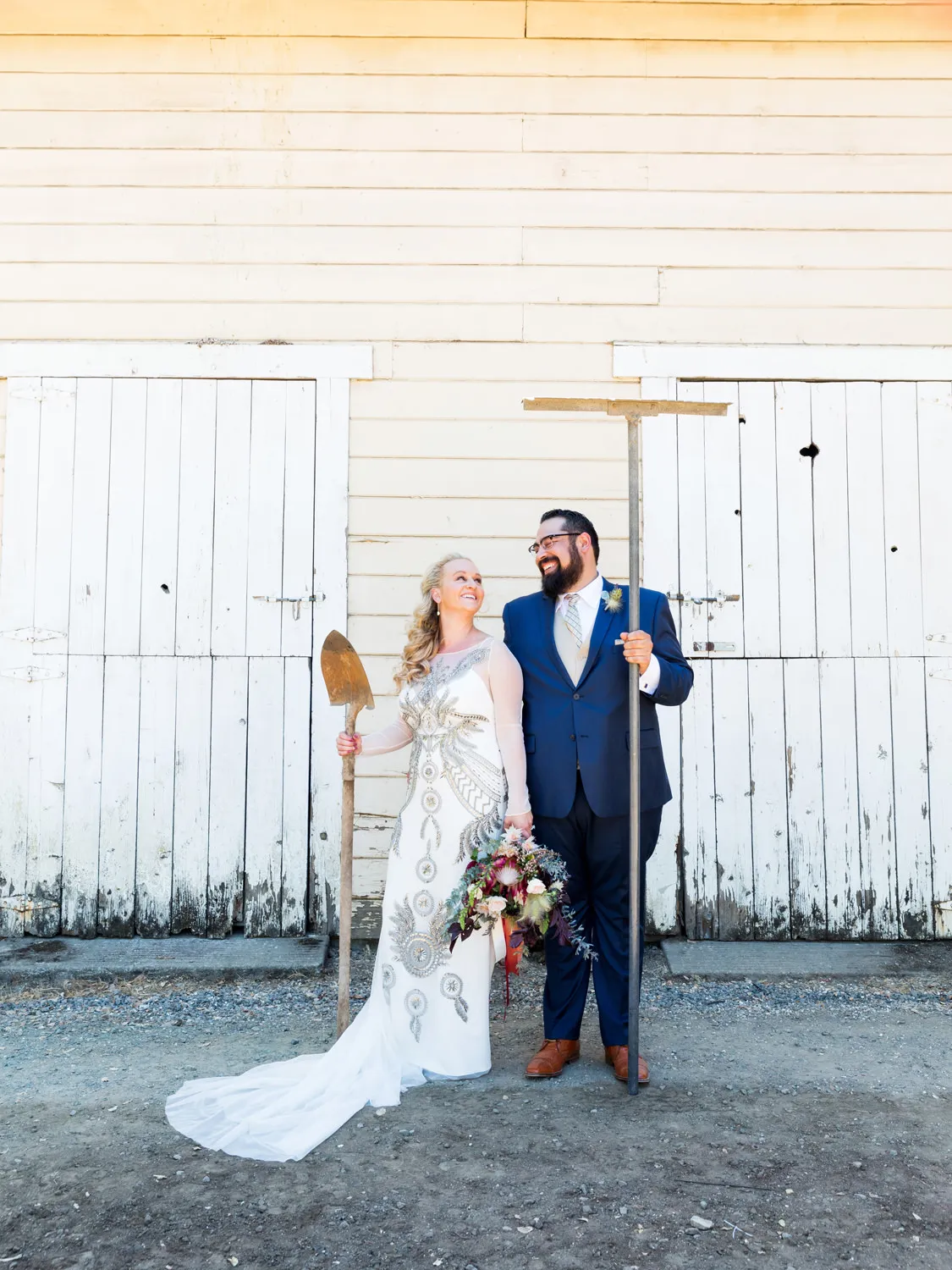 couple in front of barn beltane ranch