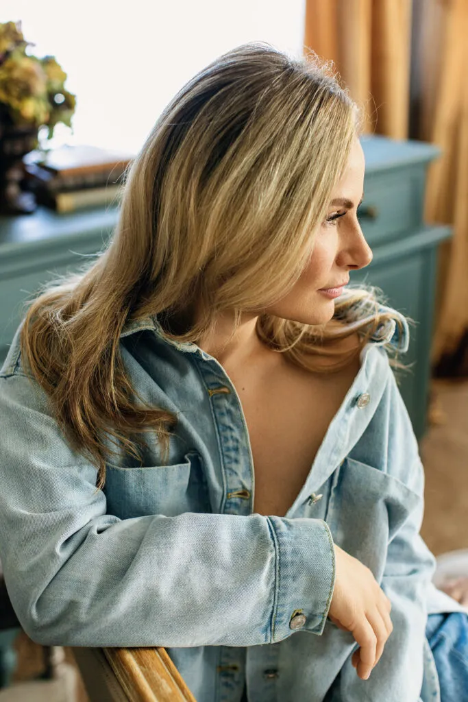 boudoir photo of women looking towards window
